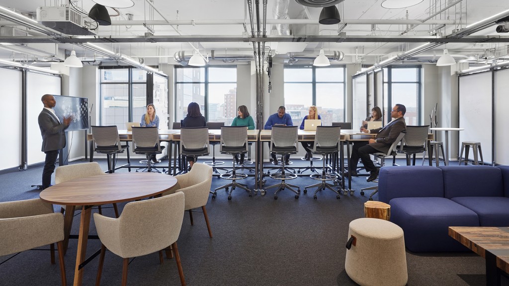 A group of people sitting at tables.